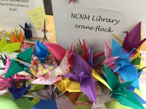 pile of multicolored origami cranes