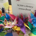 pile of multicolored origami cranes